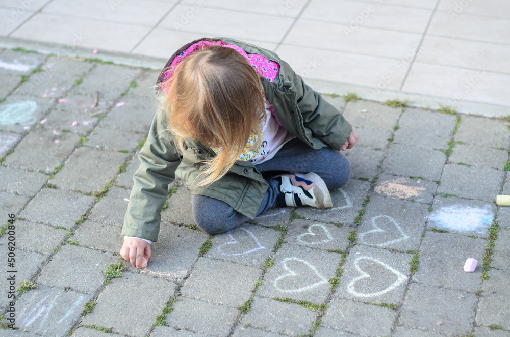 little girl playing with chalks little girl playing with chalks