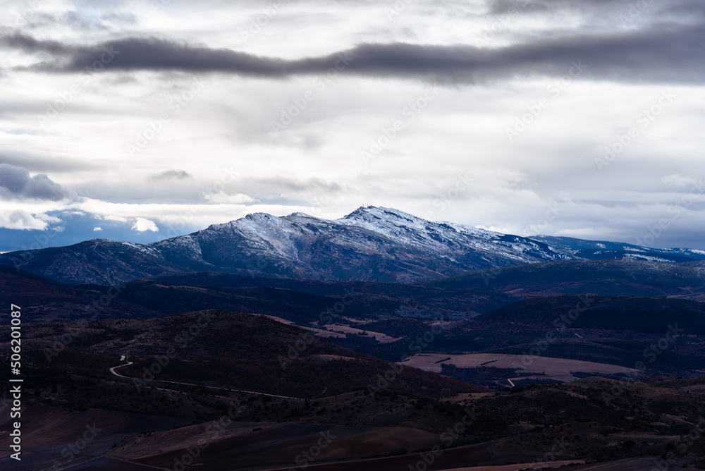 View of the peak Ocejon belonging to the mountain range of Ayllon in Guadalajara. Snowcapped peaks during wintertime View of the peak Ocejon belonging to the mountain range of Ayllon in Guadalajara. Snowcapped peaks during wintertime