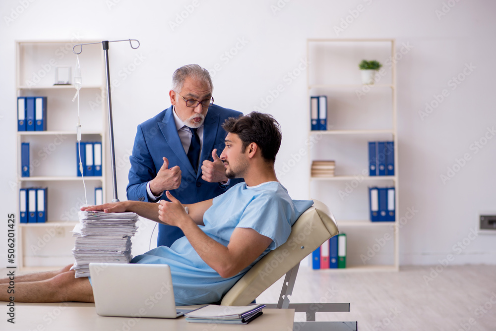 Young male employee feeling bad at workplace Young male employee feeling bad at workplace