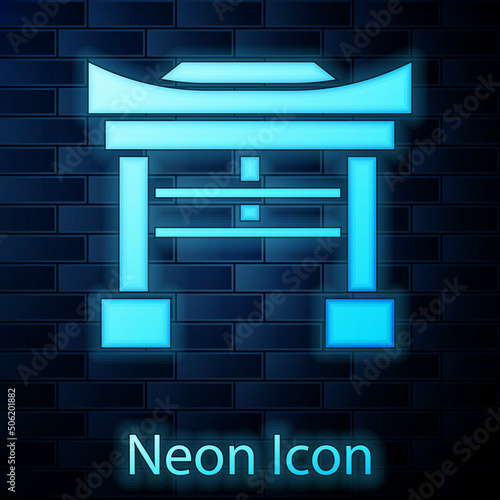 Glowing neon Japan Gate icon isolated on brick wall background. Torii gate sign. Japanese traditional classic gate symbol. Vector Illustration