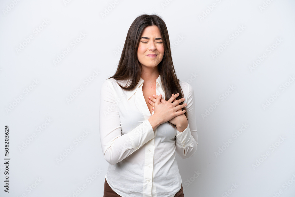 Young Brazilian woman isolated on white background having a pain in the heart Young Brazilian woman isolated on white background having a pain in the heart