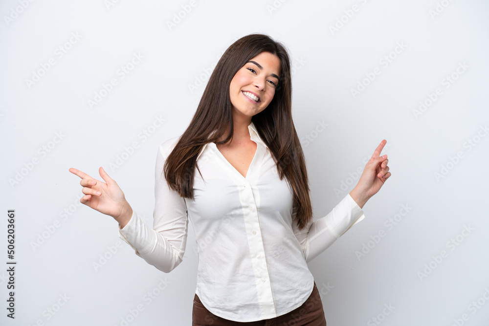 Young Brazilian woman isolated on white background pointing finger to the laterals and happy Young Brazilian woman isolated on white background pointing finger to the laterals and happy