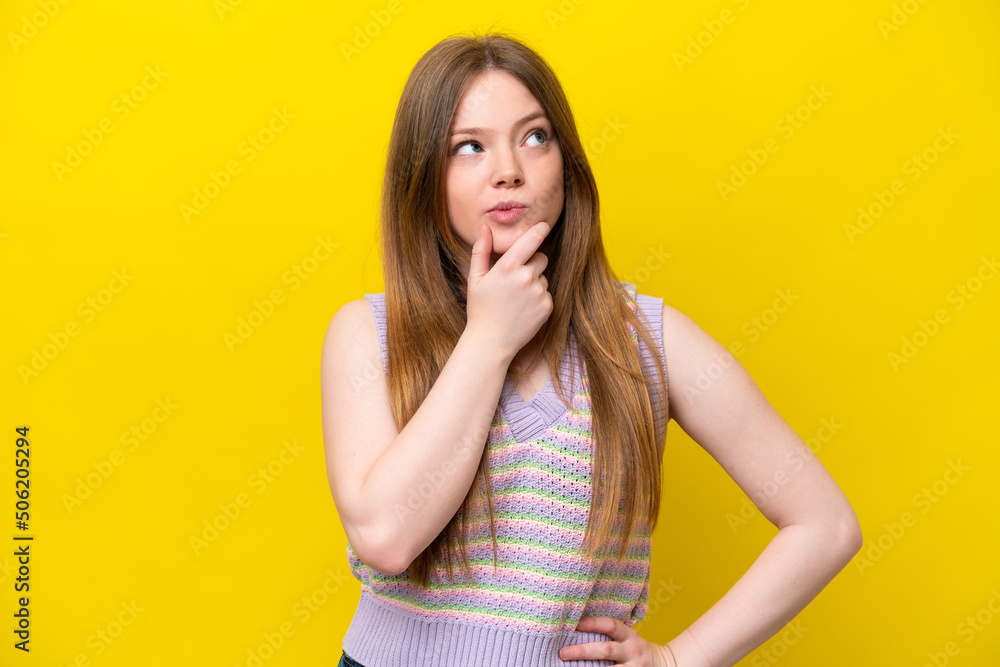 Young caucasian woman isolated on yellow background thinking an idea while looking up Young caucasian woman isolated on yellow background thinking an idea while looking up