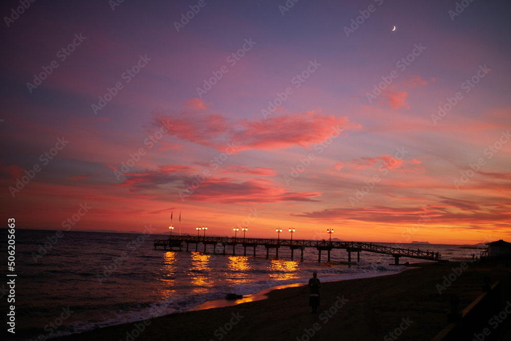 Pier at sunset. Sunset on the Mediterranean Sea. Pier at sunset. Sunset on the Mediterranean Sea.