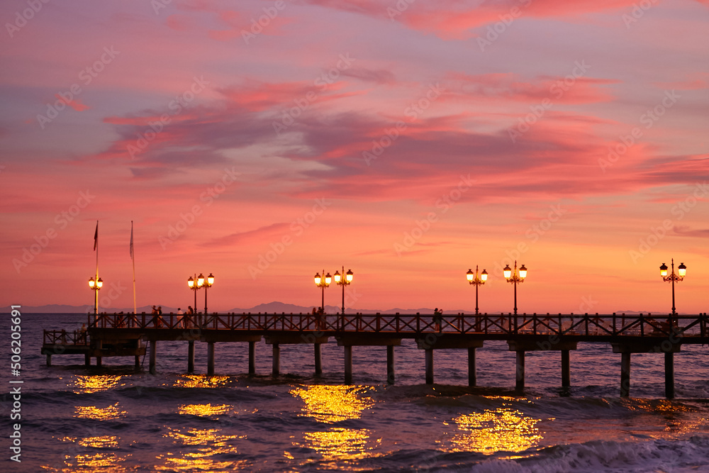 Pier at sunset. Sunset on the Mediterranean Sea.
