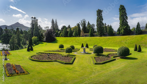 Photography Beautiful Powerscourt garden with flowerbeds, hedges and trees