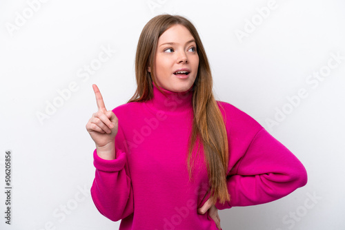 Young caucasian woman isolated on white background thinking an idea pointing the finger up
