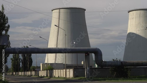 Nuclear power engineering, production of thermal and electrical energy. CHP chimney against the blue sky
