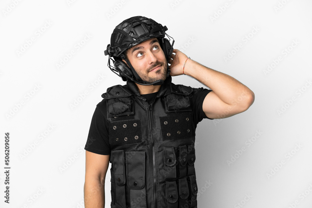 Young caucasian swat isolated on white background thinking an idea Young caucasian swat isolated on white background thinking an idea