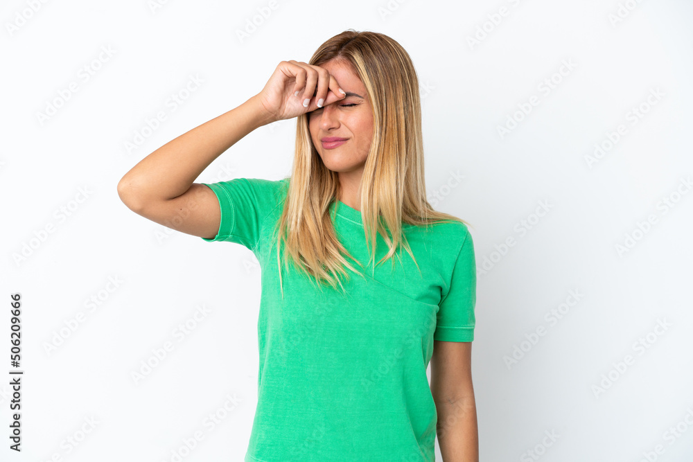 Blonde Uruguayan girl isolated on white background with tired and sick expression Blonde Uruguayan girl isolated on white background with tired and sick expression