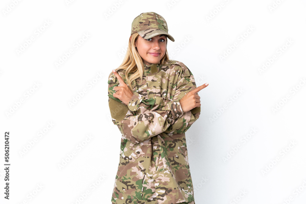 Military woman isolated on white background pointing to the laterals having doubts Military woman isolated on white background pointing to the laterals having doubts