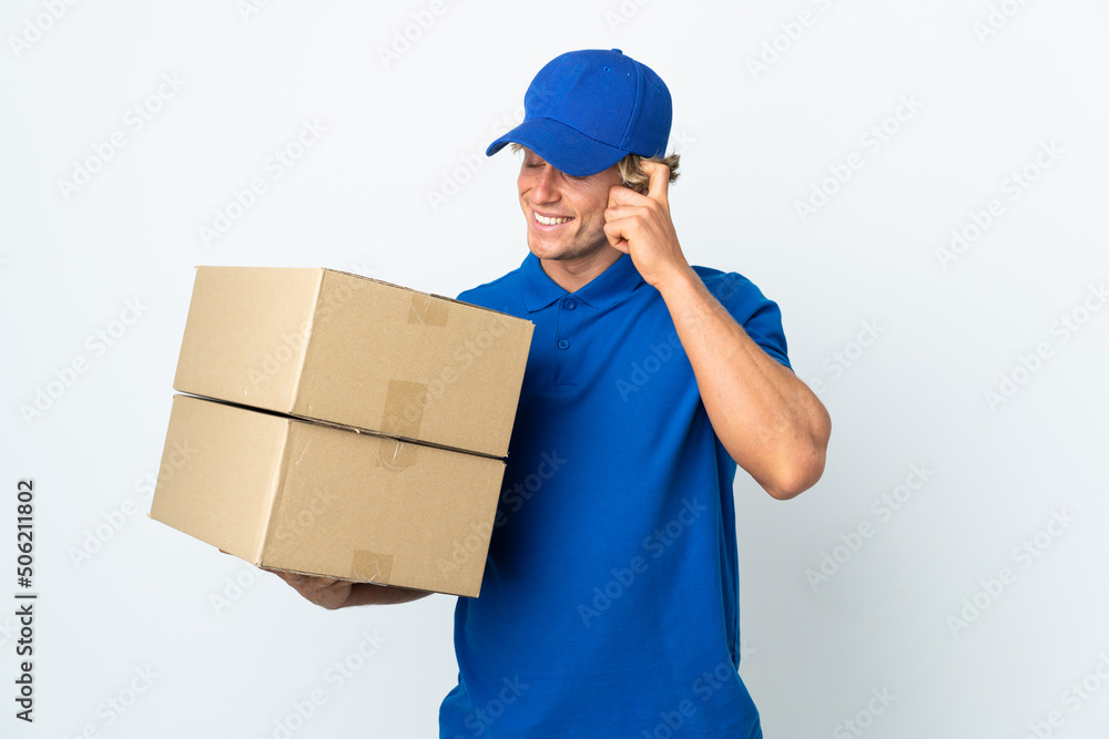 Delivery man over isolated white background laughing Delivery man over isolated white background laughing