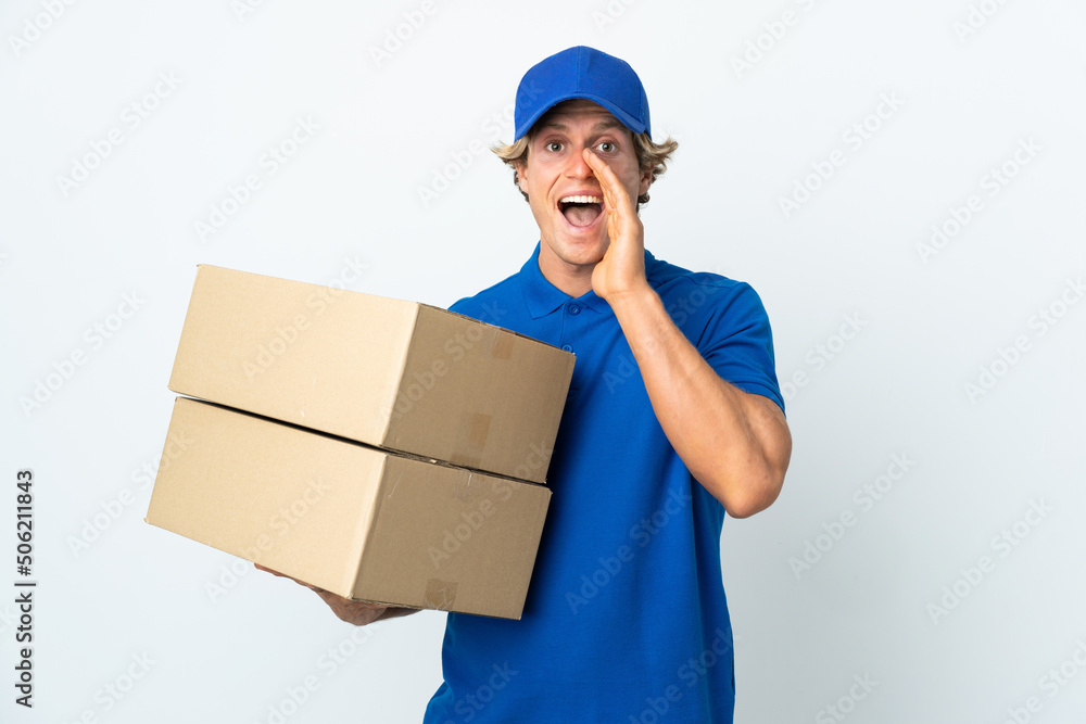 Delivery man over isolated white background shouting with mouth wide open Delivery man over isolated white background shouting with mouth wide open