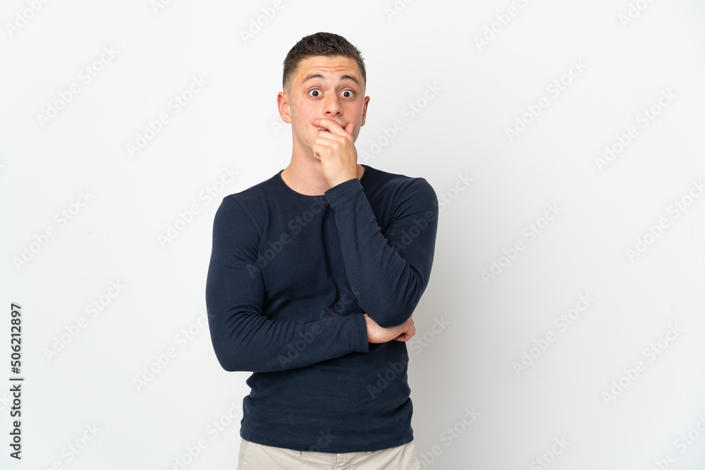 Young caucasian man isolated on white background surprised and shocked while looking right Young caucasian man isolated on white background surprised and shocked while looking right