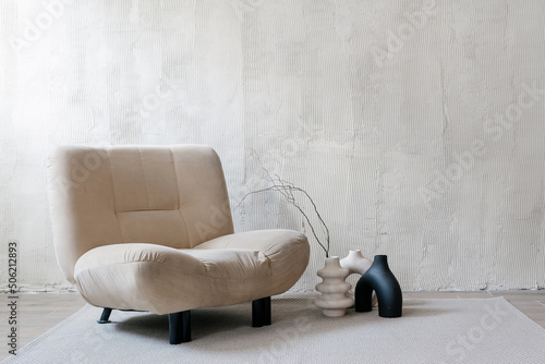 Beige armchair in contemporary cozy room interior design