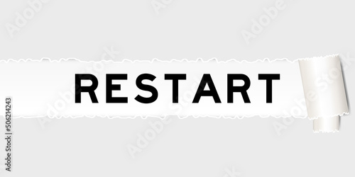 Ripped gray paper background that have word restart under torn part