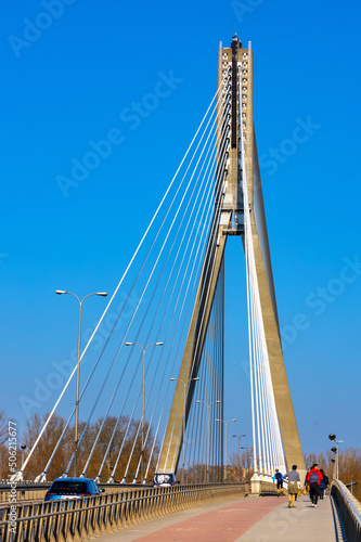 Most Swietokrzyski cable stayed bridge construction over Vistula river in Powisle downtown district of Warsaw in Poland