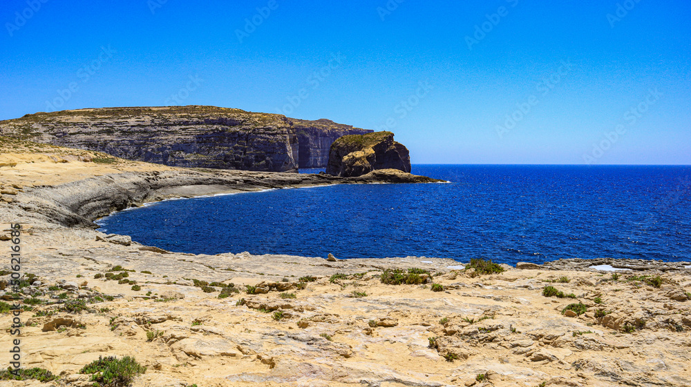 Dewijra bay and Fungus Rock on the Mediterranean island of Gozo in the Maltese archipelago. 