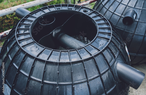 black plastic water storage tanks at the manufacturer factory depot