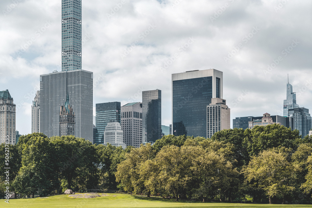 Fototapeta premium Business skyscrapers at daylight, New York central park with green trees