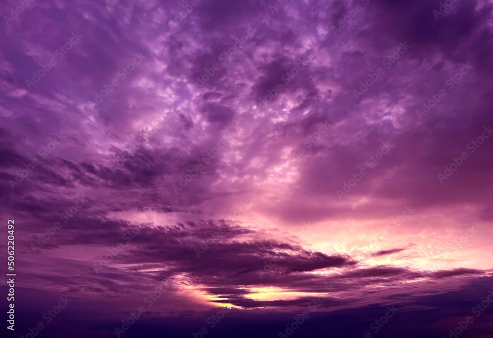Dramatic sky with purple clouds due stormy weather at night.