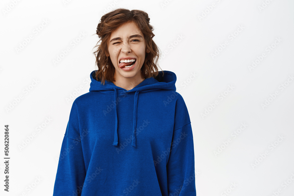 Portrait of beautiful young brunette woman, 25 years old, has white smile, healthy natural face without makeup or blemishes, posing happy against white background Portrait of beautiful young brunette woman, 25 years old, has white smile, healthy natural face without makeup or blemishes, posing happy against white background