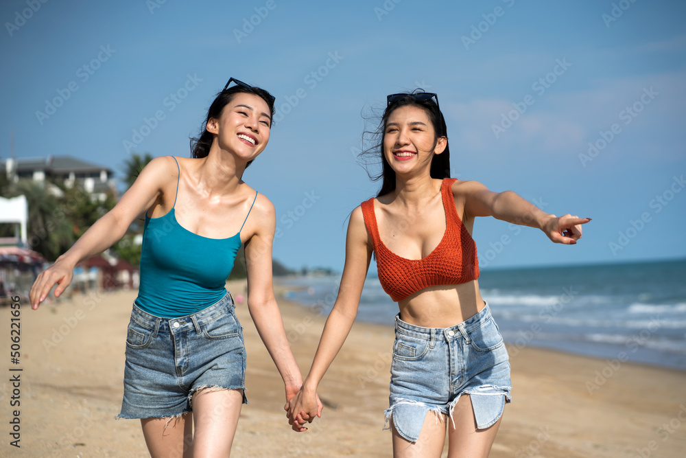 Asian happy friends is having fun at beach . Asian happy friends is having fun at beach .