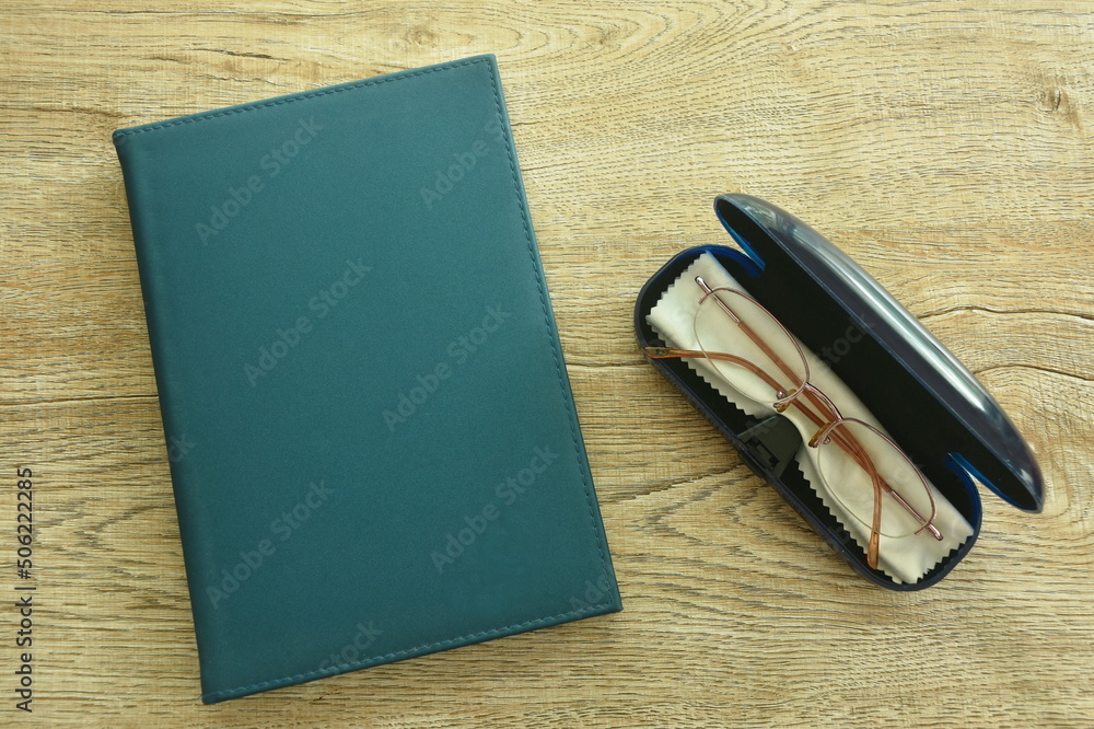 longsighted prescription glasses in box with book on table longsighted prescription glasses in box with book on table