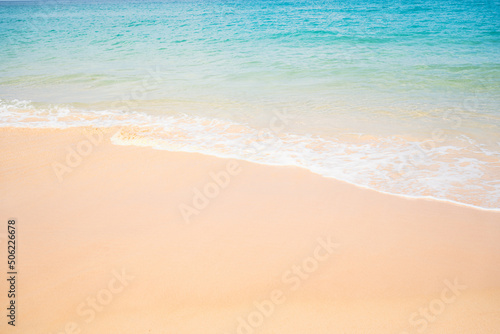 Close up white sand beach sea waves splashing shoreline.