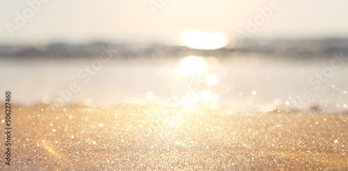 Fototapeta Naklejka Na Ścianę i Meble -  Sea waves and warm sunset light, calm and relaxing sandy beach