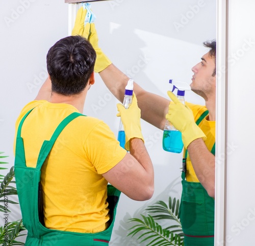 Professional cleaning contractor working at home