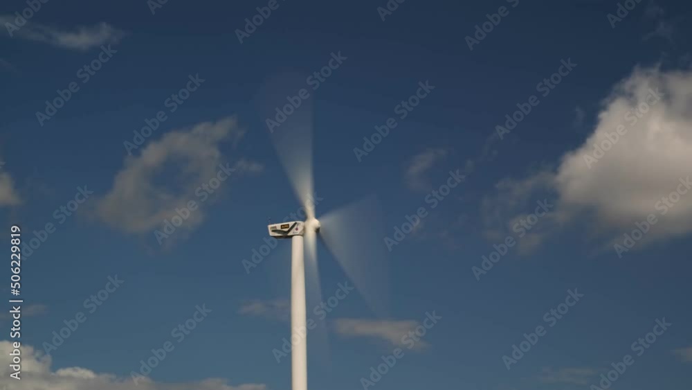 Wind Turbine Close-up and a White Cloud in the Blades Wind Turbine Close-up and a White Cloud in the Blades