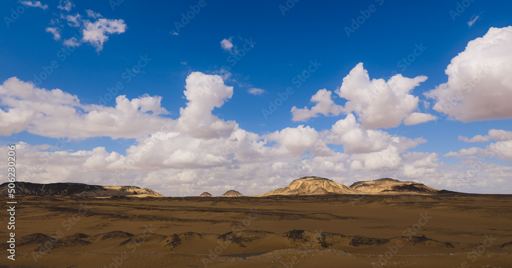 Panoramic View to the Sandy Hills in the Black Desert, is National park in the Farafra Oasis, Egypt Panoramic View to the Sandy Hills in the Black Desert, is National park in the Farafra Oasis, Egypt