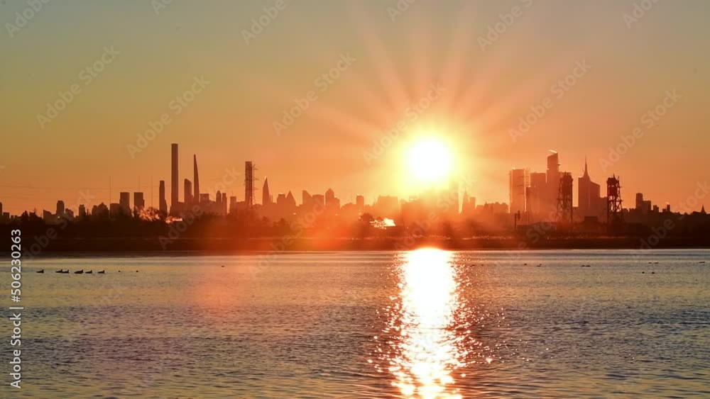 Vivid NYC sunrise over Manhattan skyline, saturated colors 4k video, travel tourism theme, silhouette buildings. Vivid NYC sunrise over Manhattan skyline, saturated colors 4k video, travel tourism theme, silhouette buildings.