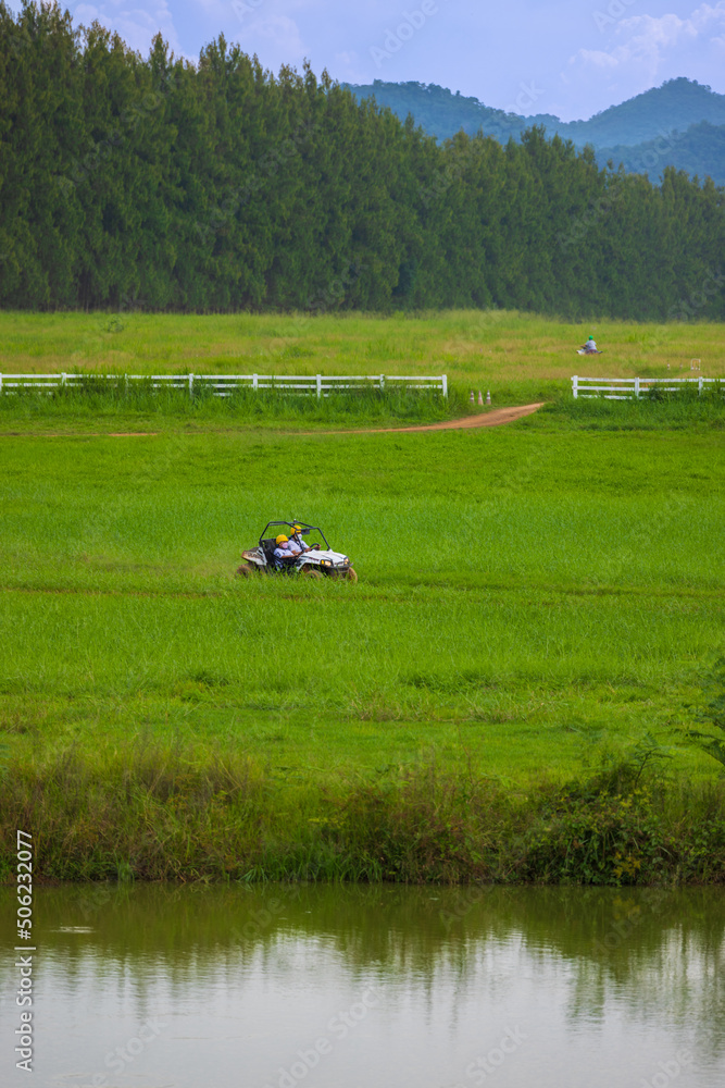 Driving in the green fields behind the mountains with bright blue skies. Driving in the green fields behind the mountains with bright blue skies.