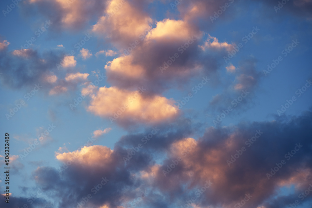 Beautiful sunset sky above clouds with dramatic light. Abstract nature background. Dramatic and moody pink, purple and blue cloudy sunset sky