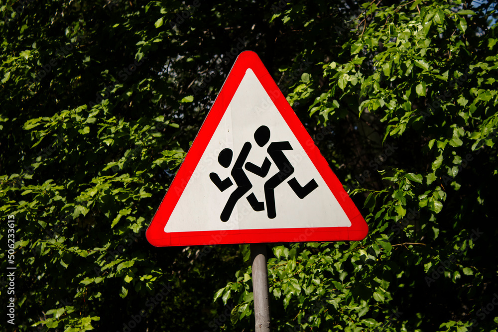 Warning signs. Children crossing. Street.