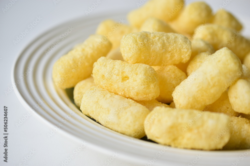 Sugar yellow corn sticks on a plate Sugar yellow corn sticks on a plate
