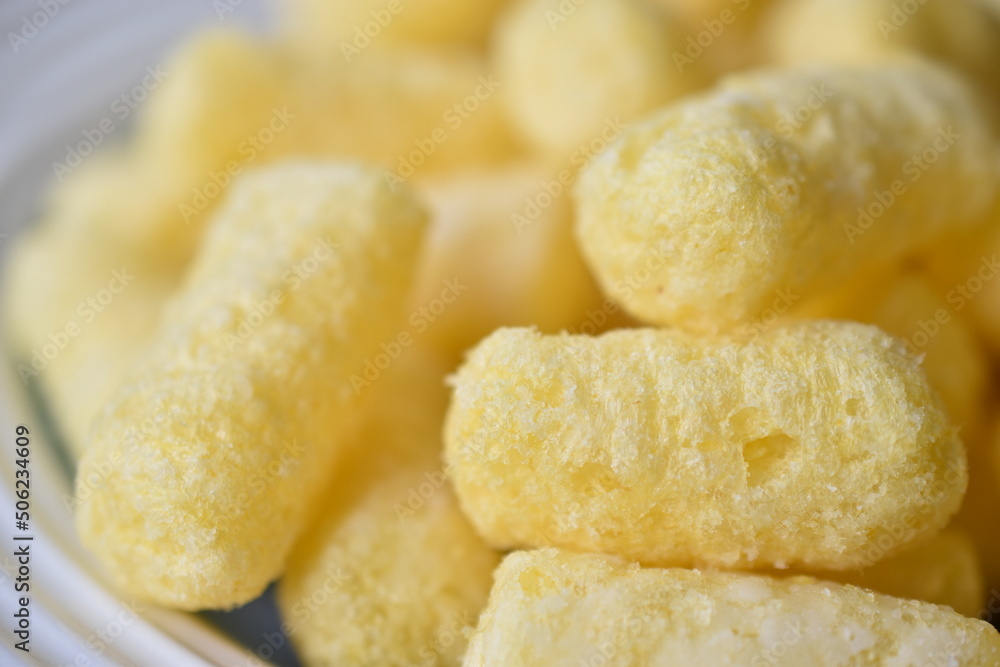 Sugar yellow corn sticks on a plate Sugar yellow corn sticks on a plate