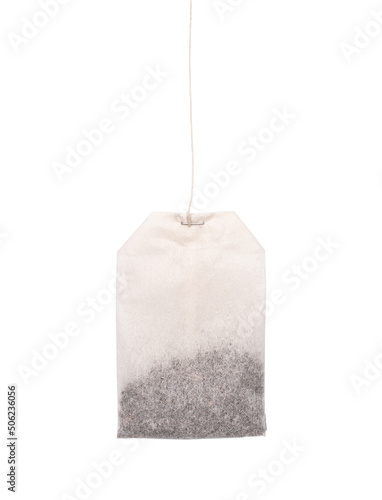 Teabag with green label. Isolated on a white. Tea.