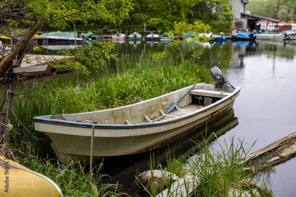 empty fishing boat in a quiet cove empty fishing boat in a quiet cove