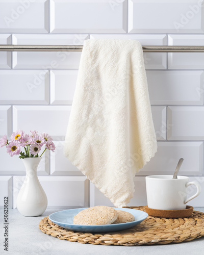 preparing for a tea party on a bright kitchen interior with a towel