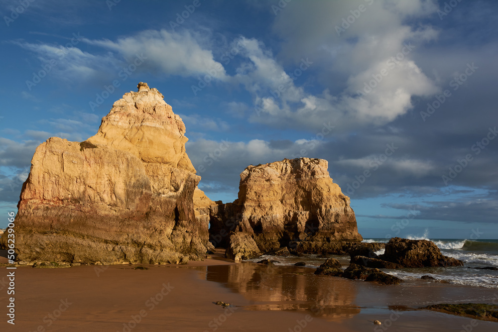 Limestone rocks at the Algarve seashore. Portimao, Portugal Limestone rocks at the Algarve seashore. Portimao, Portugal