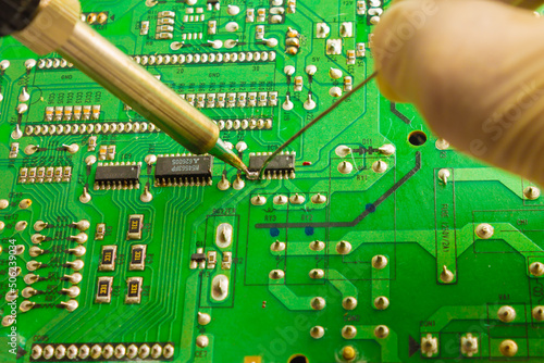 Fixing the chip with a soldering iron using tin solder