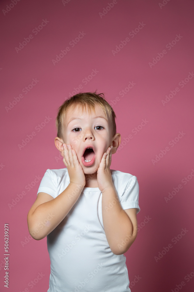 Caucasian boy 3 years old makes scary faces while looking at the camera Caucasian boy 3 years old makes scary faces while looking at the camera
