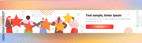 mix race businesspeople holding review stars rating customer feedback satisfaction level online survey concept