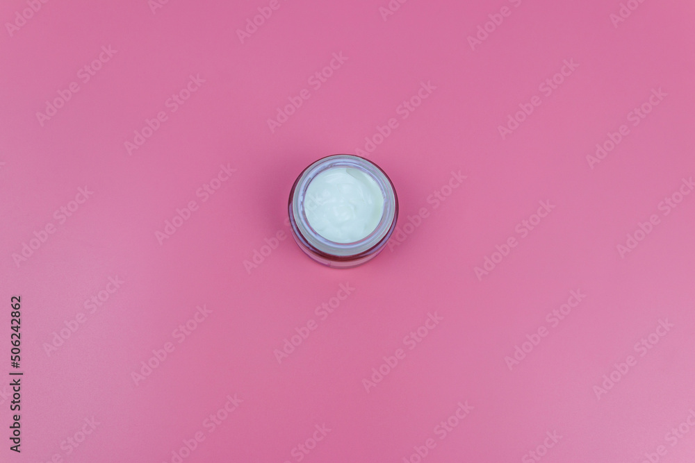 Face cream on a pastel pink background. Top view Face cream on a pastel pink background. Top view