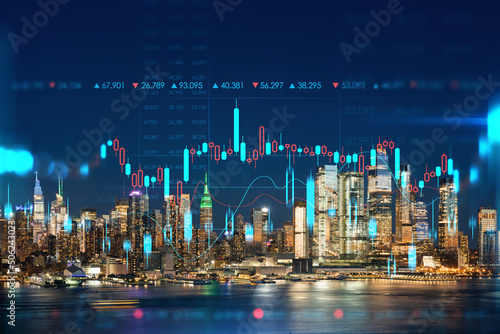 New York City skyline from New Jersey over the Hudson River with Hudson Yards at night. Manhattan, Midtown. Forex candlestick graph hologram. The concept of internet trading, brokerage, analysis © VideoFlow