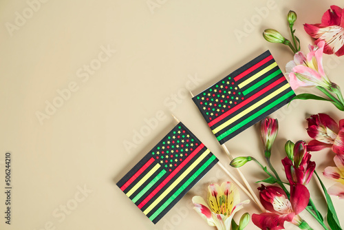 creative background for Juneteenth day with Black Liberation African American flags and bright flowers