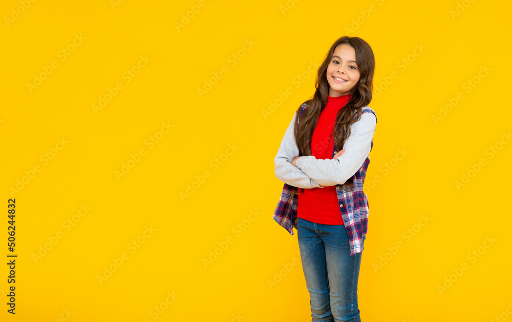back to school. female fashion model. kid in casual clothes on yellow background. back to school. female fashion model. kid in casual clothes on yellow background.